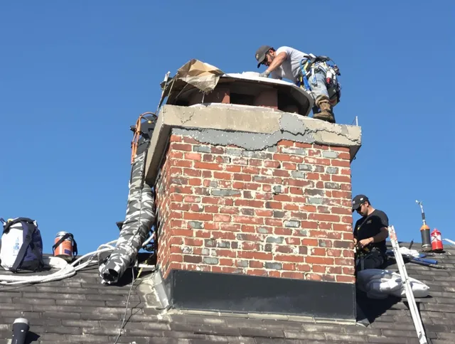 Charlotte Chimney Sweep installing a custom chimney crown in Charlotte, NC