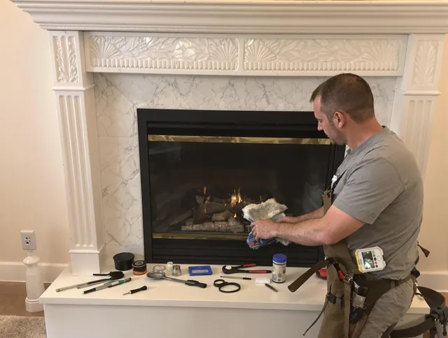 Charlotte Chimney Sweep performing fireplace maintenance in Charlotte, NC