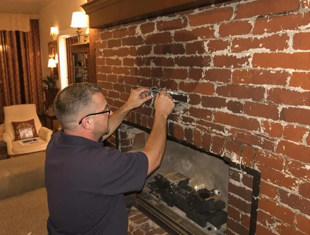 Charlotte Chimney Sweep expert fixing a fireplace in Charlotte, NC